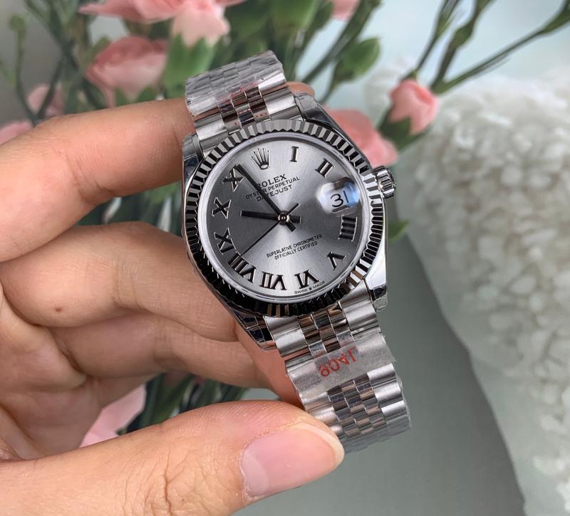 Detailed macro view of GS Factory Rolex278274 white gold fluted bezel vs genuine